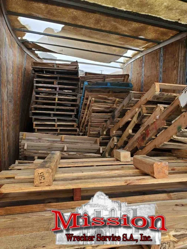 mission wrecker service pallets in trailer before schertz wrecker service activities